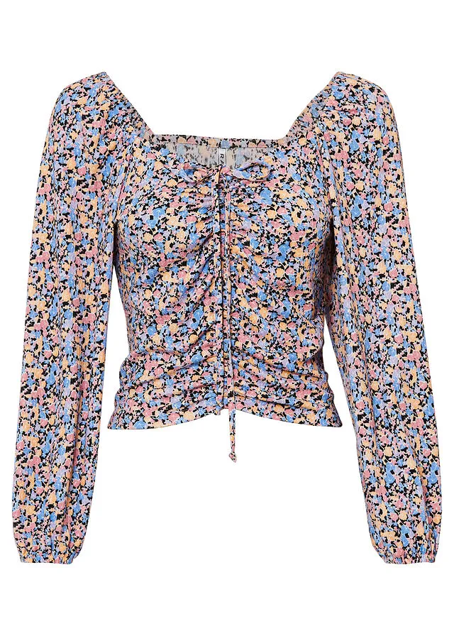 CAMISETA ESTAMPADA CON FRUNCIDO ROSA BRILLANTENEGRO CON FLORES