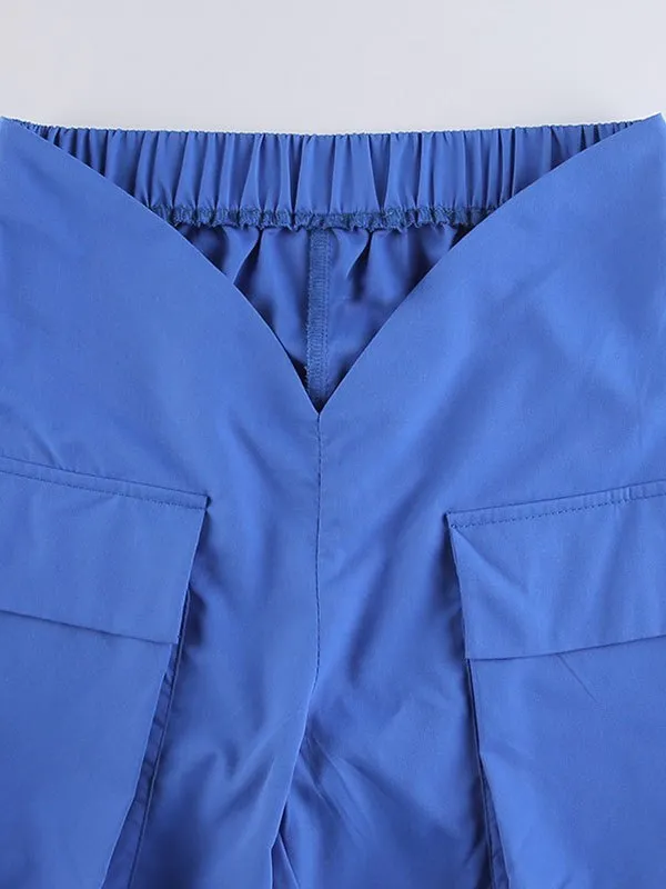 Pantalones de pierna recta con bolsillo con corte en V