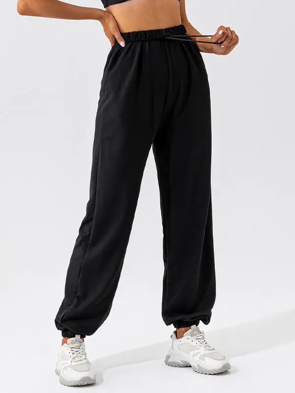 Pantalones deportivos con pies atados con cordón liso