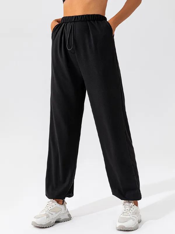 Pantalones deportivos con pies atados con cordón liso